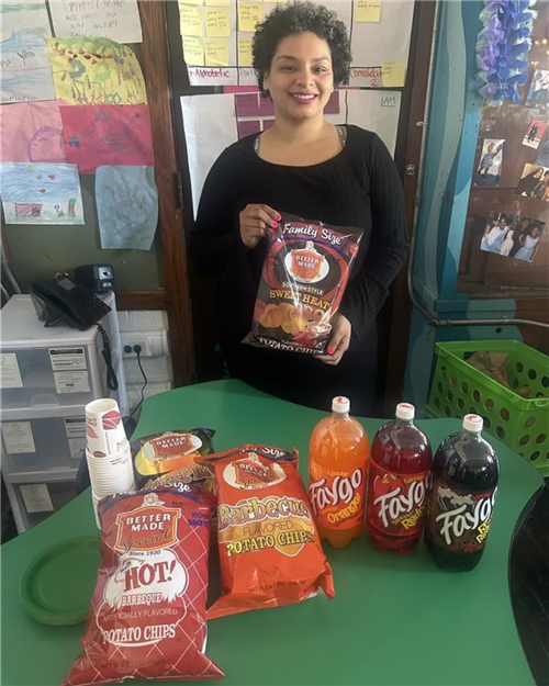 teacher with Detroit made pop and chips